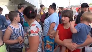 Russian TV Evacuees flee Belgorod amid explosion [upl. by Lawler159]