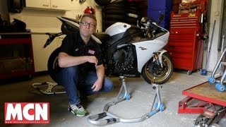 How to Use a paddock stand  Products  Motorcyclenewscom [upl. by Hubie555]