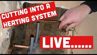 PLUMBING TRICK CUTTING INTO LIVE CENTRAL HEATING PIPES to fit RADIATOR without draining the system [upl. by Nylad]